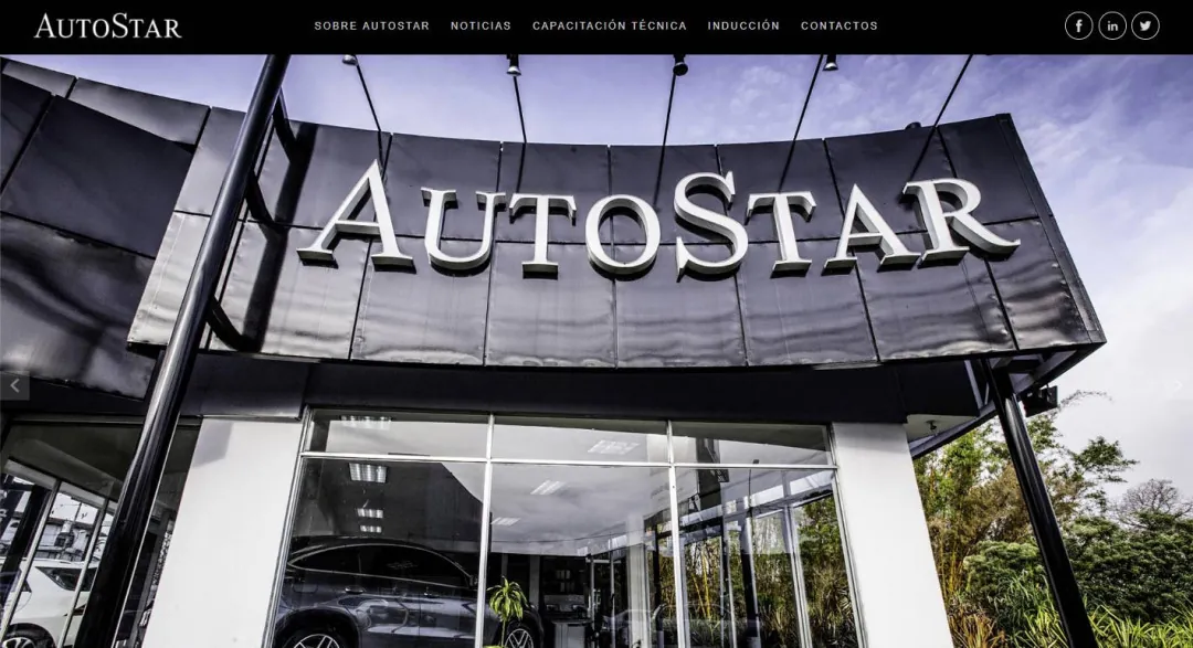 AutoStar: the illuminated AutoStar sign above the dealership's entrance