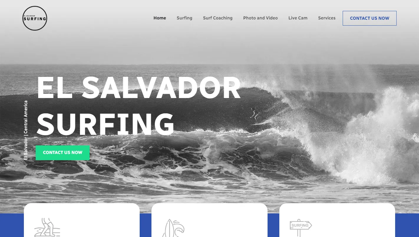 El Salvador Surfing: the homepage hero showing a large wave breaking in black and white